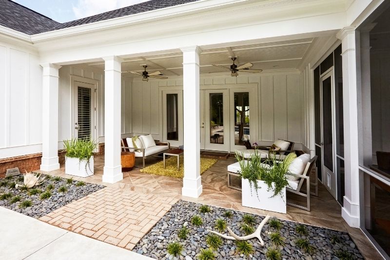 An open-air patio that is attached to a house